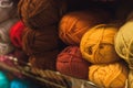Colored skeins of wool on a store shelf. Woolen skeins for knitting all the colors of the rainbow, blue, brown, red and purple Royalty Free Stock Photo