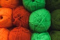 Colored skeins of wool on a store shelf. Woolen skeins for knitting all the colors of the rainbow, green, brown, red and orange Royalty Free Stock Photo