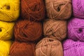 Colored skeins of wool on a store shelf. Woolen skeins for knitting all the colors of the rainbow, brown, yellow, red and purple Royalty Free Stock Photo