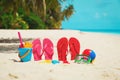 Colored slippers, toys and diving mask at beach Royalty Free Stock Photo