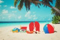 Colored slippers, toys and diving mask at beach Royalty Free Stock Photo