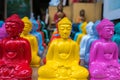 Colored small statues of Buddhas on sale in Ubud tourist market, Bali