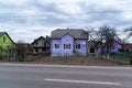 Colored soviet rural house in the countryside of Ukraine in purple color in the town of Sheyn