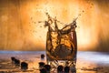 Splash of cold ice in glass of whiskey isolated on a light background Royalty Free Stock Photo