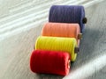 Colored spools of thread for seamstresses, side view Royalty Free Stock Photo