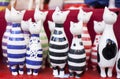 Handmade ceramic cats with colored stripes for sale on a Christmas market in Budapest, Hungary
