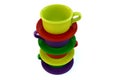 Colored stacked coffee cups on white