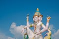 Colored statue of Hindu god called Brahma on blue sky background Royalty Free Stock Photo