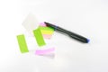 Colored sticky notes and pen Royalty Free Stock Photo