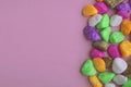 Colored stones, on a pink background, top view, lying on a flat surface Royalty Free Stock Photo