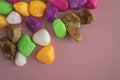 Colored stones, on a pink background, top view, lying on a flat surface Royalty Free Stock Photo