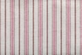 Colored striped coarse linen fabric texture closeup as background. Rustic canvas fabric texture Royalty Free Stock Photo