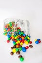 Multicolor candies in glass jars isolate on white background