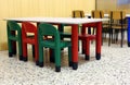 Colored tables and chairs in the dining room of the kindergarten Royalty Free Stock Photo