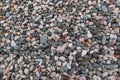 Colored texture pebbles on the beach. stones of different shapes and sizes
