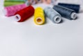 Colored thread for sewing. White background. Circle of spools of thread. Side view. Royalty Free Stock Photo
