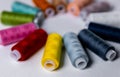 Colored thread for sewing. White background. Circle of spools of thread. Side view. Royalty Free Stock Photo