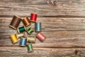 Colored thread spools on a wooden backgroundce Royalty Free Stock Photo