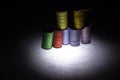 Colored threads for sewing. Skeins of colored threads on a black background Royalty Free Stock Photo