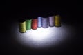 Colored threads for sewing. Skeins of colored threads on a black background Royalty Free Stock Photo