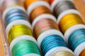 Colored threads for sewing in skeins lie together Royalty Free Stock Photo