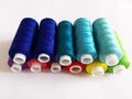 colored threads for sewing on a white background Royalty Free Stock Photo
