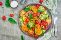 Colored tomato salad with onion and basil. Vegan food. Royalty Free Stock Photo