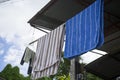 colored towels to be dried on a clothes horse outside. Fresh clean towels drying on washing line outdoor. Laundry hangs on the Royalty Free Stock Photo