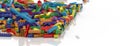 Colored toy bricks background. Rainbow colors. Random coloured plastic construction blocks. 3D illustration. 3D