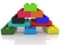 Colored toy bricks in the form of a pyramid on white Royalty Free Stock Photo