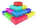 Colored toy bricks stacked in a pyramid Royalty Free Stock Photo