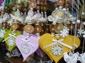 Colored traditional suspended wood hearts in a market in Germany.