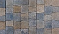 colored trapezoid concrete tiles pavement in high angle view - full frame background and texture