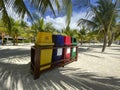 Colored trash cans, container on a white sandy beach in a palm forest. Ecological, waste disposal Royalty Free Stock Photo