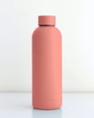 Colored tumbler bottle on white table with white background