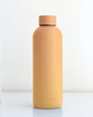 Colored tumbler bottle on white table with white background