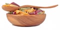 Colored uncooked italian pasta penne in a wooden bowl on a white Royalty Free Stock Photo