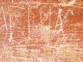 Colored vector grunge texture of cracked, scratched, damaged paint on an orange wall Royalty Free Stock Photo