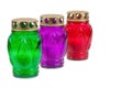 Colored votive candles on white background