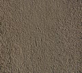 colored wall with plaster finish texture in sand grains
