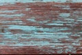 Colored wood background with peeling old paint