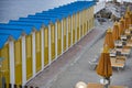 colored wooden cabins in the bathing establishments of a beach