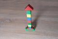 Colored wooden cubes, builds houses and rockets, the concept of the development of creativity, fine motor skills, patience and