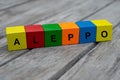 colored wooden cubes with letters. the word aleppo is displayed, abstract illustration Royalty Free Stock Photo