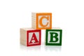 Colored wooden letter blocks on a white background