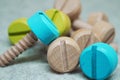 Colored wooden screws bolts repair tool children`s toy interesting background Royalty Free Stock Photo