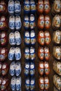 Colored wooden shoes, a traditional souvenir from Holland, hanging on the wall.