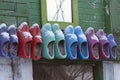 Colored wooden shoes on wall Royalty Free Stock Photo