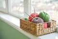 Colored yarn balls in wicker  basket Royalty Free Stock Photo