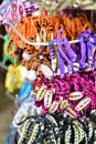 Colored yarn wrist charms being sold as souvenirs